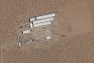 This Aug. 7, 2025, satellite image shows construction of large white tents for a new...