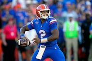 Florida quarterback DJ Lagway looks for a receiver during the first half of an NCAA college...