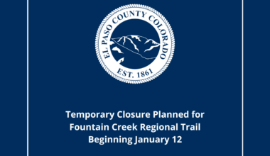 Square blue graphic with text reading press release temporary closure planned for Fountain Creek Regional Trail Beginning January 12. Also included is the white El Paso County Seal.