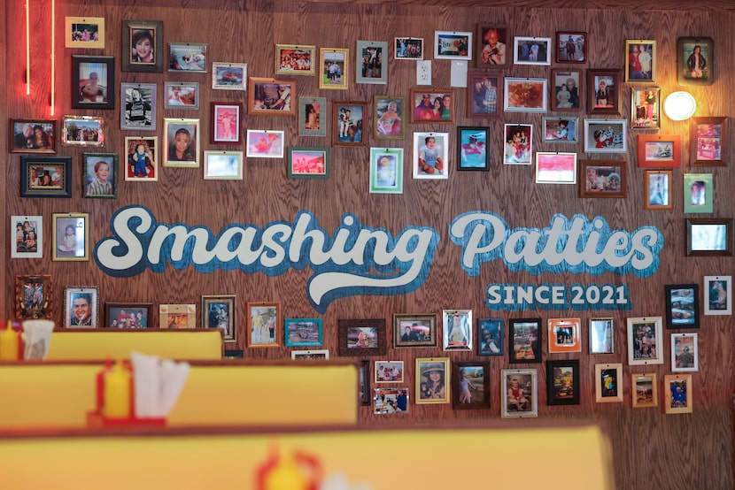 A photo wall remain as a part of the interior of Burger Schmurger, a new burger joint in...