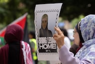 Protesters gather outside of the Earle Cabell Federal Building as a court hearing for the...