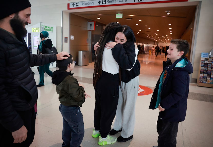 Jocelyn Grimes of Carrollton Hughs her daughter and Southwest Airlines traveler Jaelyn...