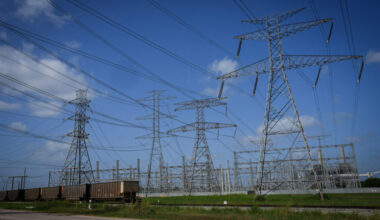Transmission lines connect to a power plant near Richmond, Texas. Credit: Jon Shapley/Houston Chronicle via Getty Images