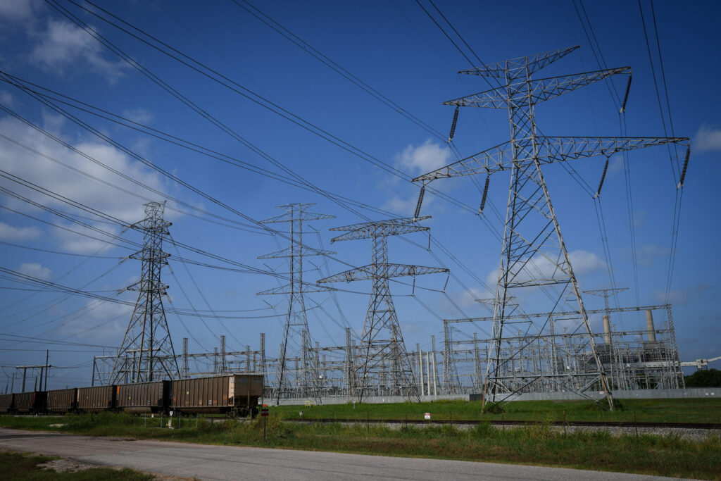 Transmission lines connect to a power plant near Richmond, Texas. Credit: Jon Shapley/Houston Chronicle via Getty Images