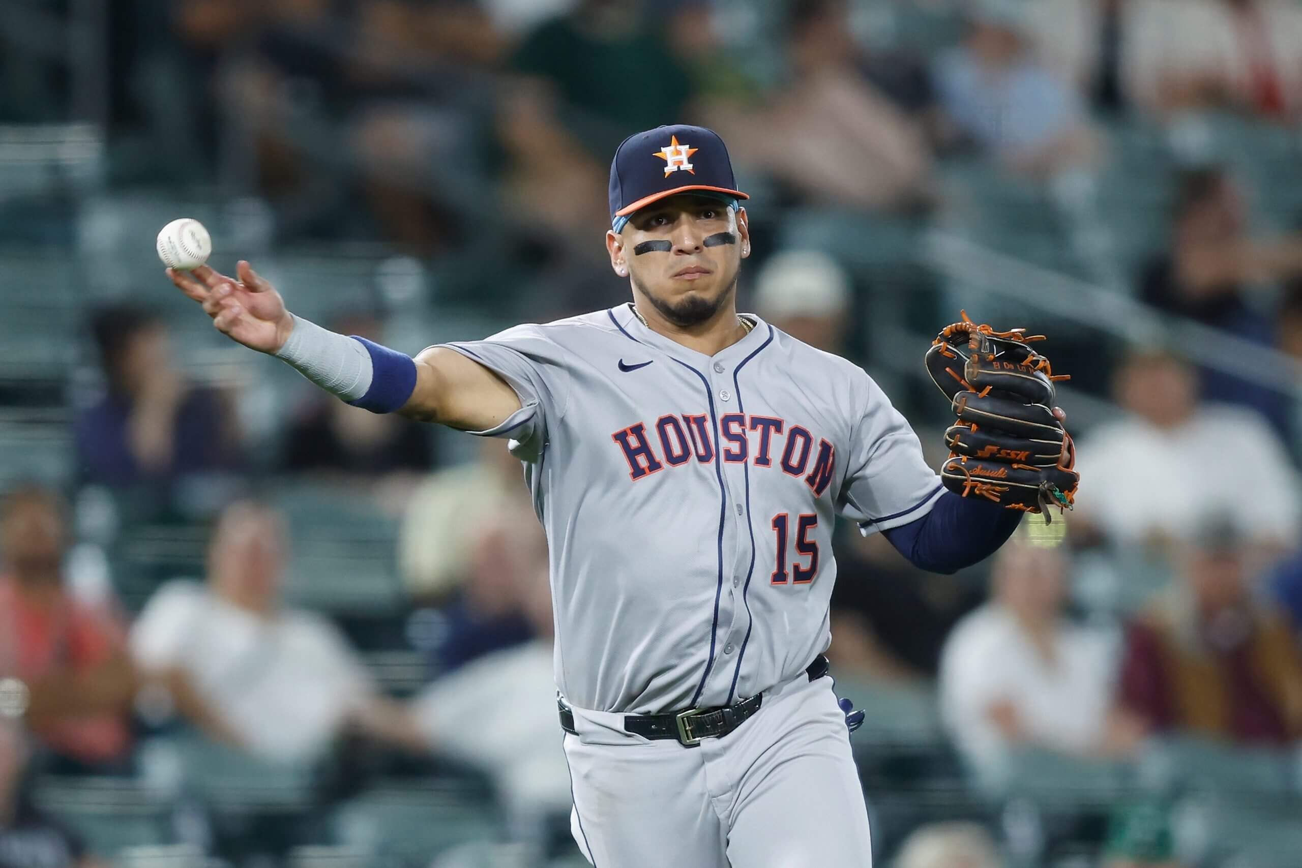 Isaac Paredes throws to first for the Astros.