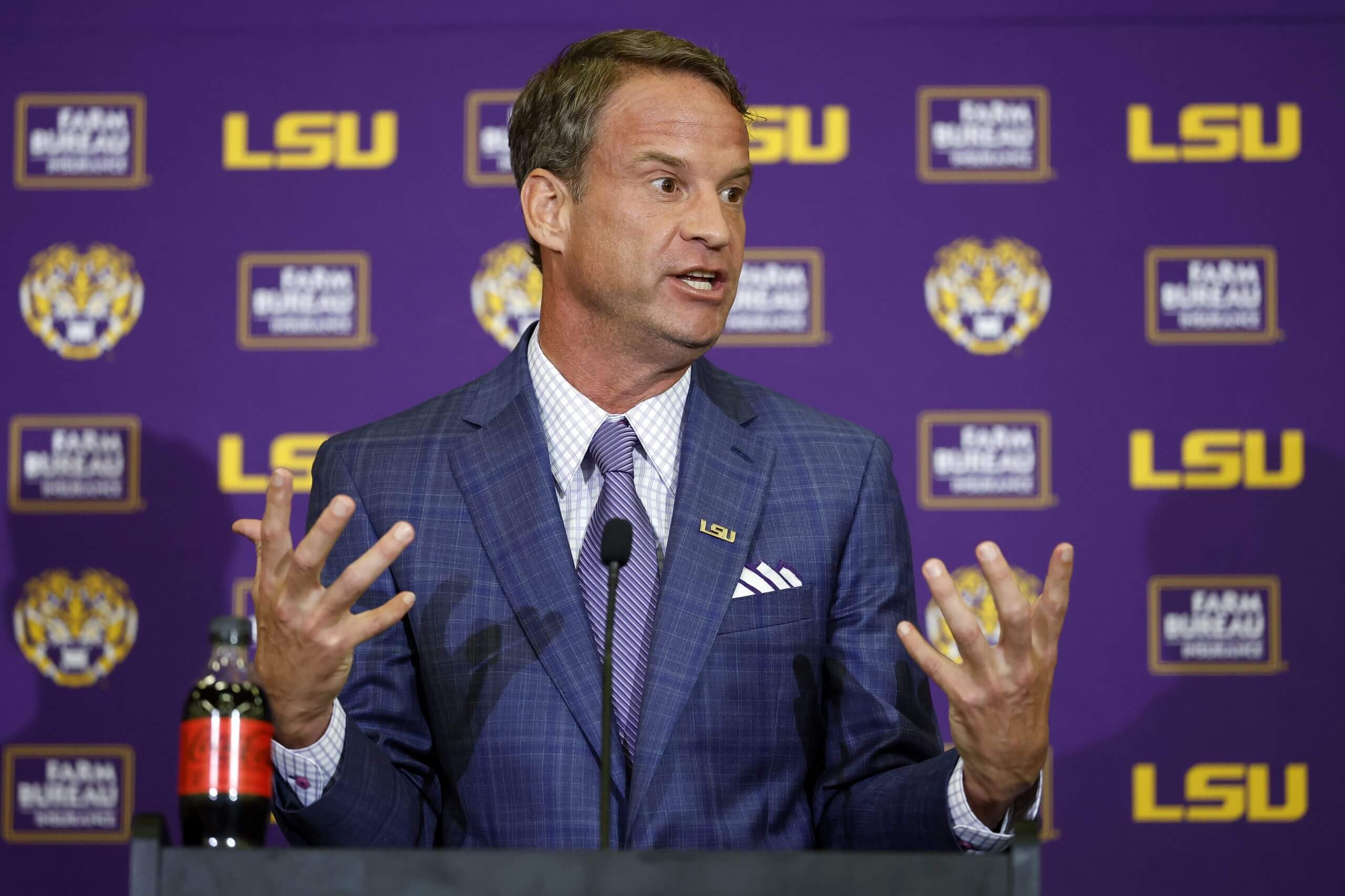 New LSU coach Lane Kiffin reacts during his introductory news conference