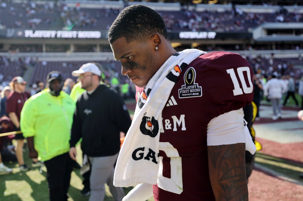 Marcel Reed walks off the field after losing to the Miami Hurricanes 10-3 during the 2025 College Football Playoff First Round Game at Kyle Field on December 20, 2025 in College Station, Texas. 