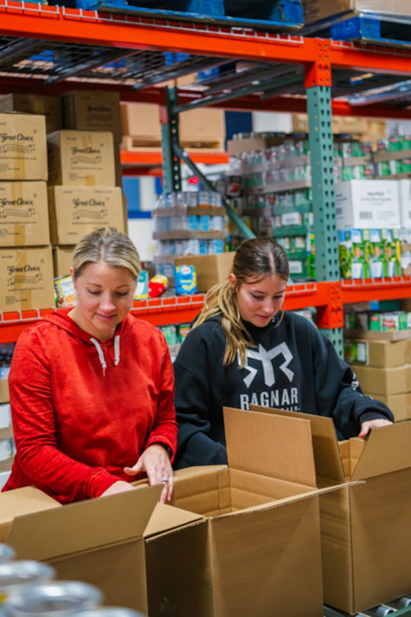 Members of the Prosper Texas Stake volunteer with Lovepacs to pack boxes of food for children in need in Prosper, Texas, Dec. 13, 2025.