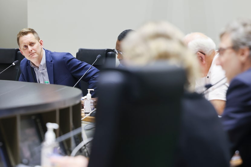 Police oversight board chairman John Mark Davidson (left) officiates the monthly Community...