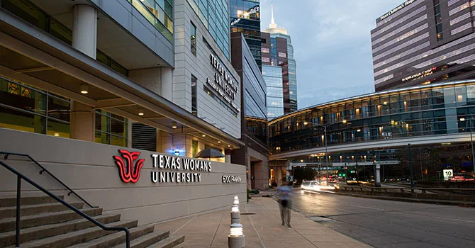 The TWU Houston campus lit up in the evening.