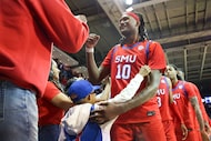 Southern Methodist University center Jaden Toombs (10) cheers with the fans following their...
