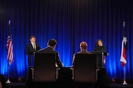 KXAN-TV's Daniel Marin and Dallas Morning News' Gromer Jeffers moderate a debate between...