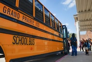 Elementary students board the bus in Grand Prairie ISD.