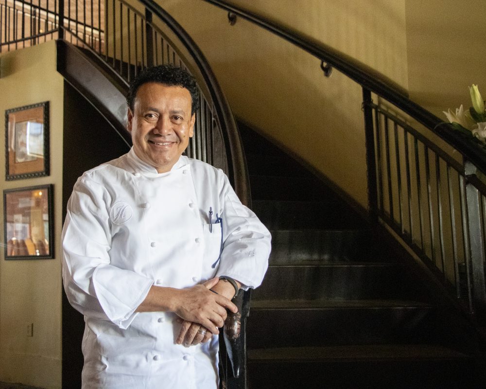 Chef Ortega stands at the entrance of his restaurant Hugo's, which opened in 2002.