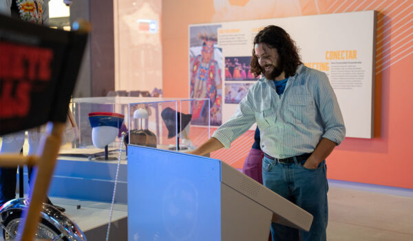 A male guest uses an interactive display at the ITC