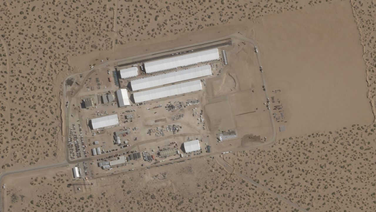 This Aug. 7, 2025, satellite image shows construction of large white tents for a new immigrant detention center at Fort Bliss, a U.S. Army base outside El Paso, Texas. (Planet Labs via AP)