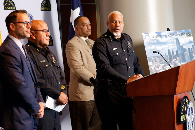 Dallas police Chief Daniel C. Comeaux, right, speaks during a news conference regarding the...