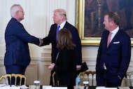 President Donald Trump speaks with Chief Executive Officer and Chairman of ExxonMobil Darren...