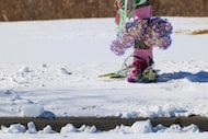 Flowers and other remembrances are seen at the site where two girls were involved in...