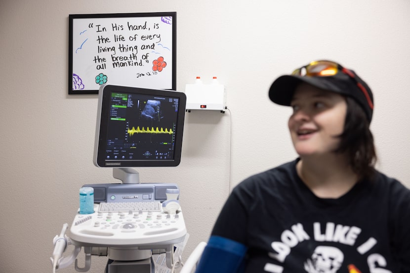 A white board reads, “In His hand, is the life of every living thing and the breath of all...