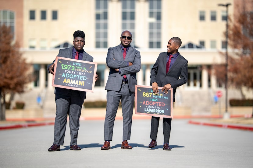 Laterras R. Whitfield (center) with his two adopted sons, Armani (left) and LaDarrion (right).
