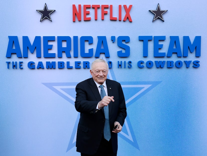 Dallas Cowboys owner Jerry Jones poses for photos on the blue carpet for his movie premiere...