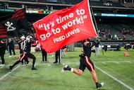 Melissa linebacker Max Corbin (4) and linebacker Jaylon Frazier (12) lead their team as they...