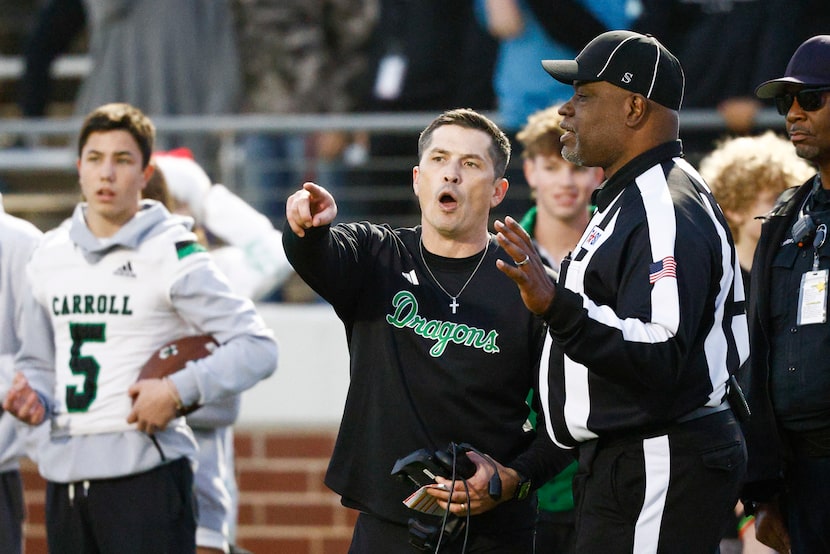 Southlake Carroll head coach Riley Dodge talks with a referee after being stopped at the...