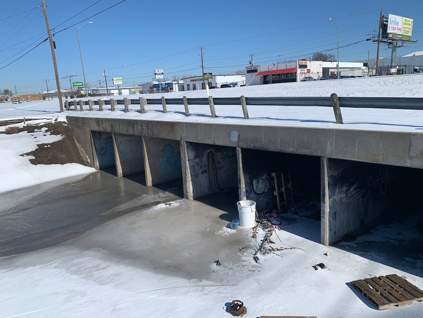 Water was streaming through the Harry Hines Boulevard storm-drainage tunnels Monday morning....