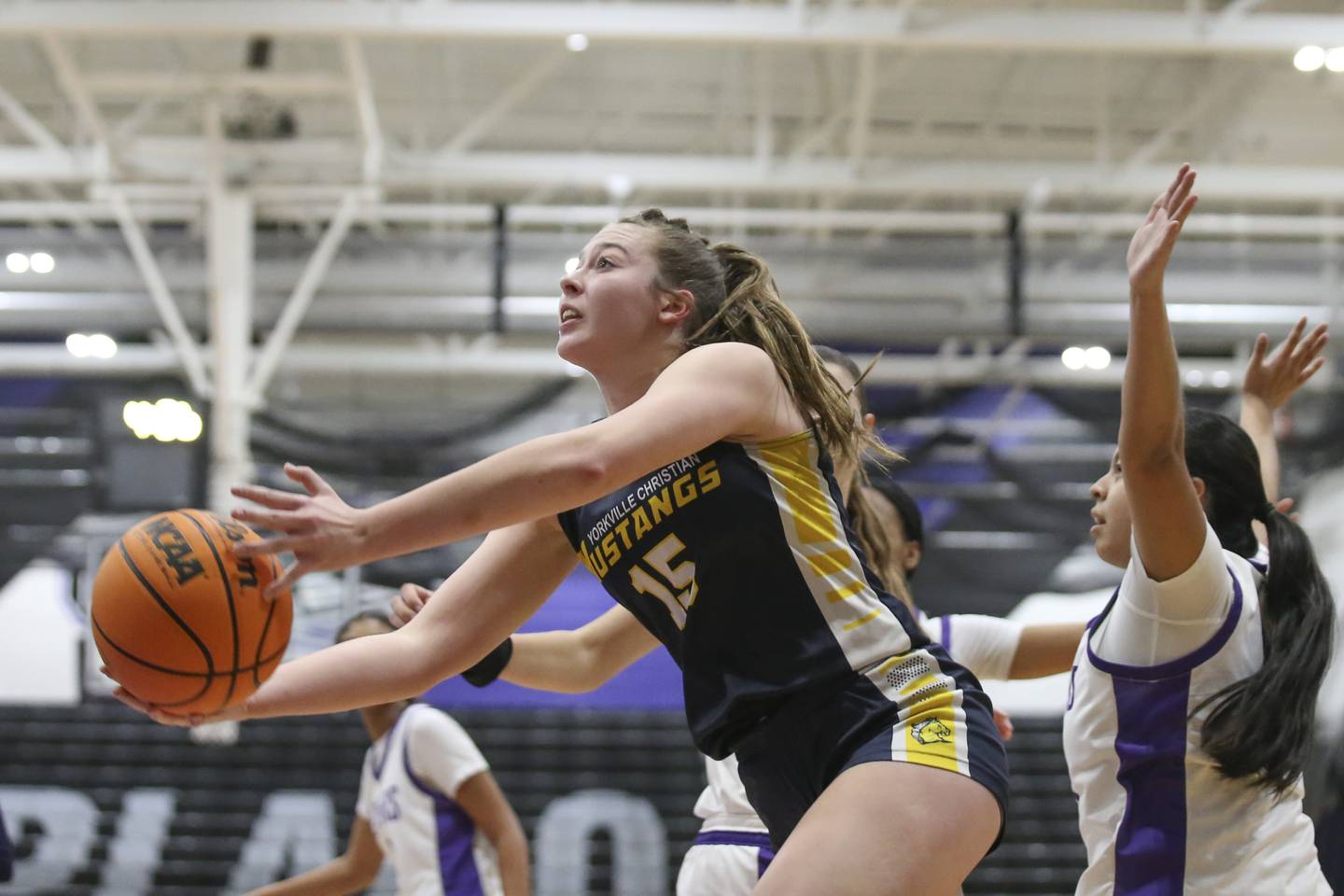 Yorkville Christian's Payton Wallin (25) tries an underhand shot at the basket during their basketball game between Yorkville Christian at Plano Wednesday, Jan 07, 2026 in Plano.
