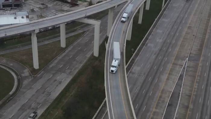 Ice stalls vehicles on Houston flyover ramps, 18-wheelers forced to reverse