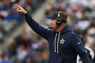 Dallas Cowboys head coach Brian Schottenheimer speaks to his team during the first half of...