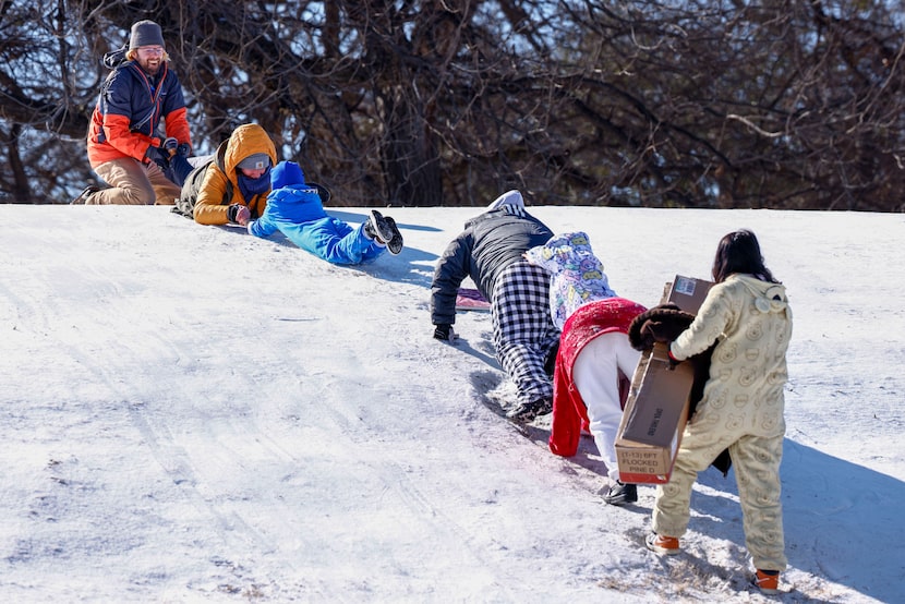 Stefan Nelson (from left) and his partner Cassie Maguire, 35, form a human chain to help...