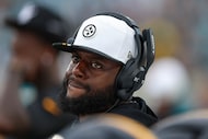 Pittsburgh Steelers outside linebackers coach Denzel Martin walks the sideline wearing a...