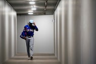 Texas Rangers infielder Sebastian Walcott walks through a tunnel to the field before the...