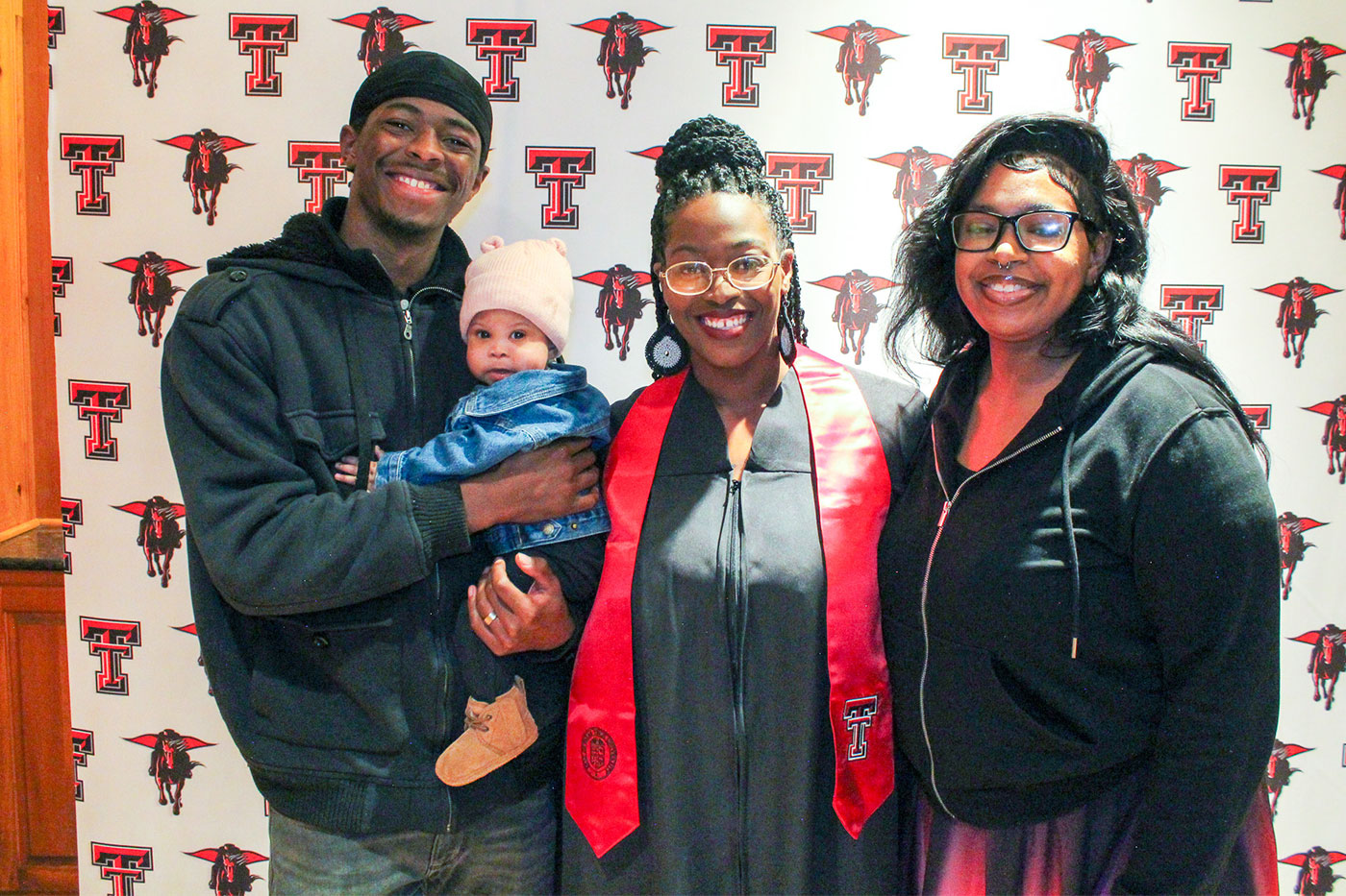 Treilon holding grandbaby Kaylani, Rossalynn and daughter-in-law Ta-Nia  