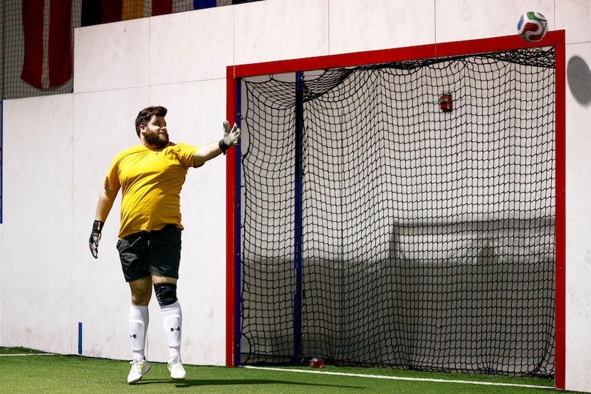 Goalie Daniel Rager watches as a shot just misses the goal during a Man v Half Soccer game,...