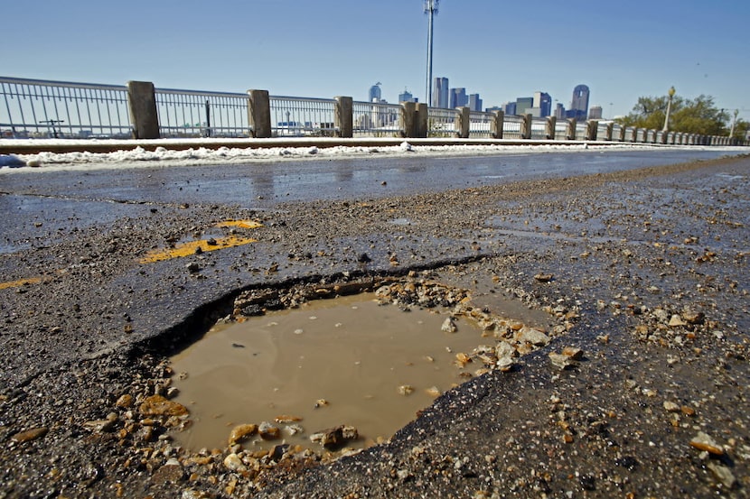 A pothole along Malcolm X Blvd on Thursday, March 5,  2015 in Dallas.