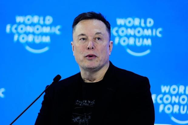 Elon Musk attends the Annual Meeting of the World Economic Forum in Davos, Switzerland, Thursday, Jan. 22, 2026. (AP Photo/Markus Schreiber)