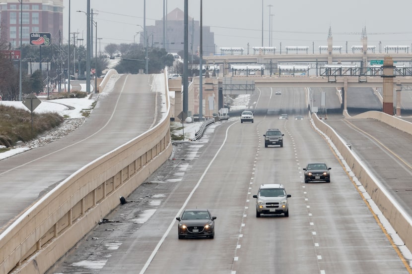 Cars drive along Interstate 30 near Collins Street, Friday, Jan. 10, 2025, in Arlington.