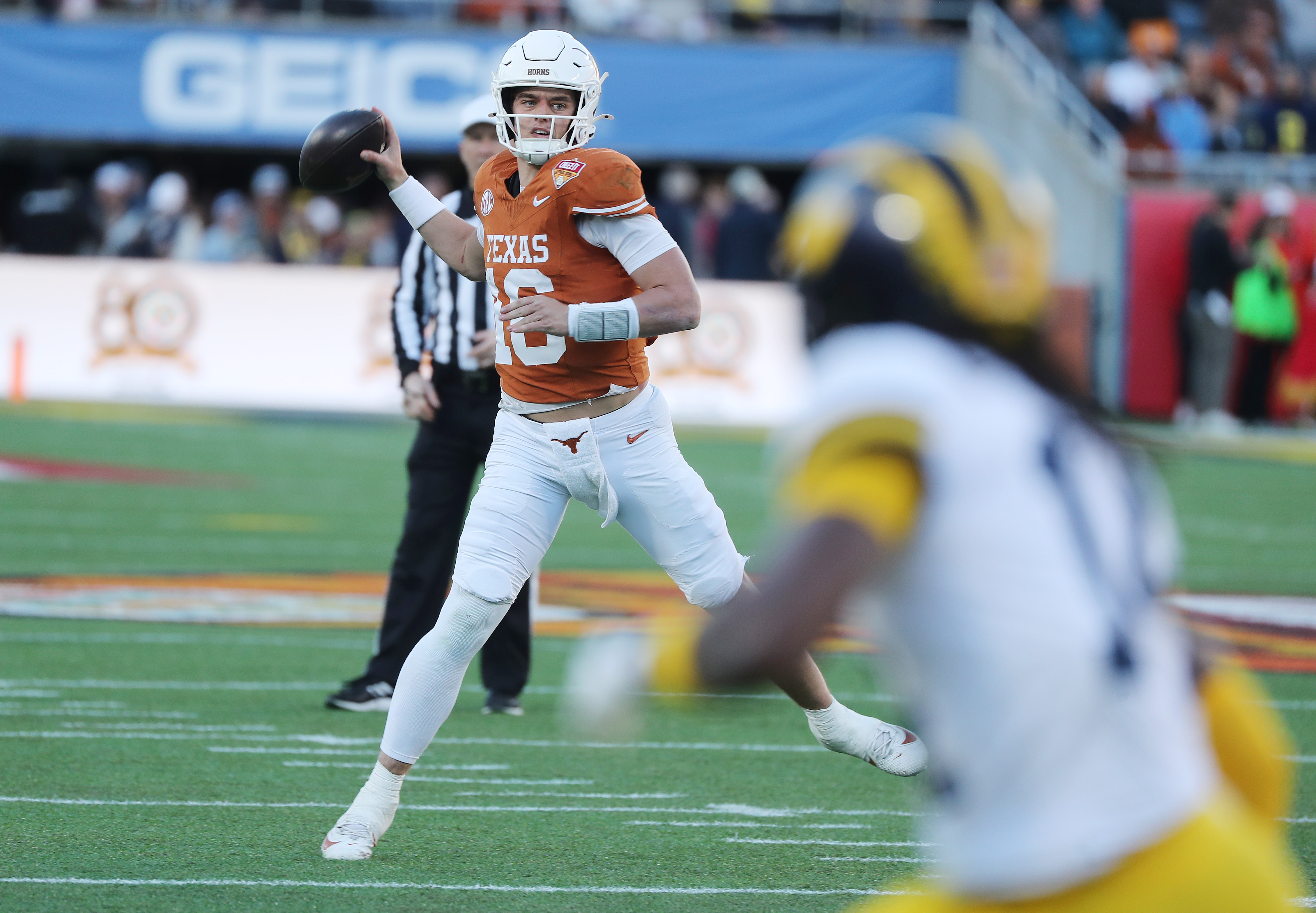 Texas quarterback Arch Manning throws during the Cheez-It Citrus Bowl...