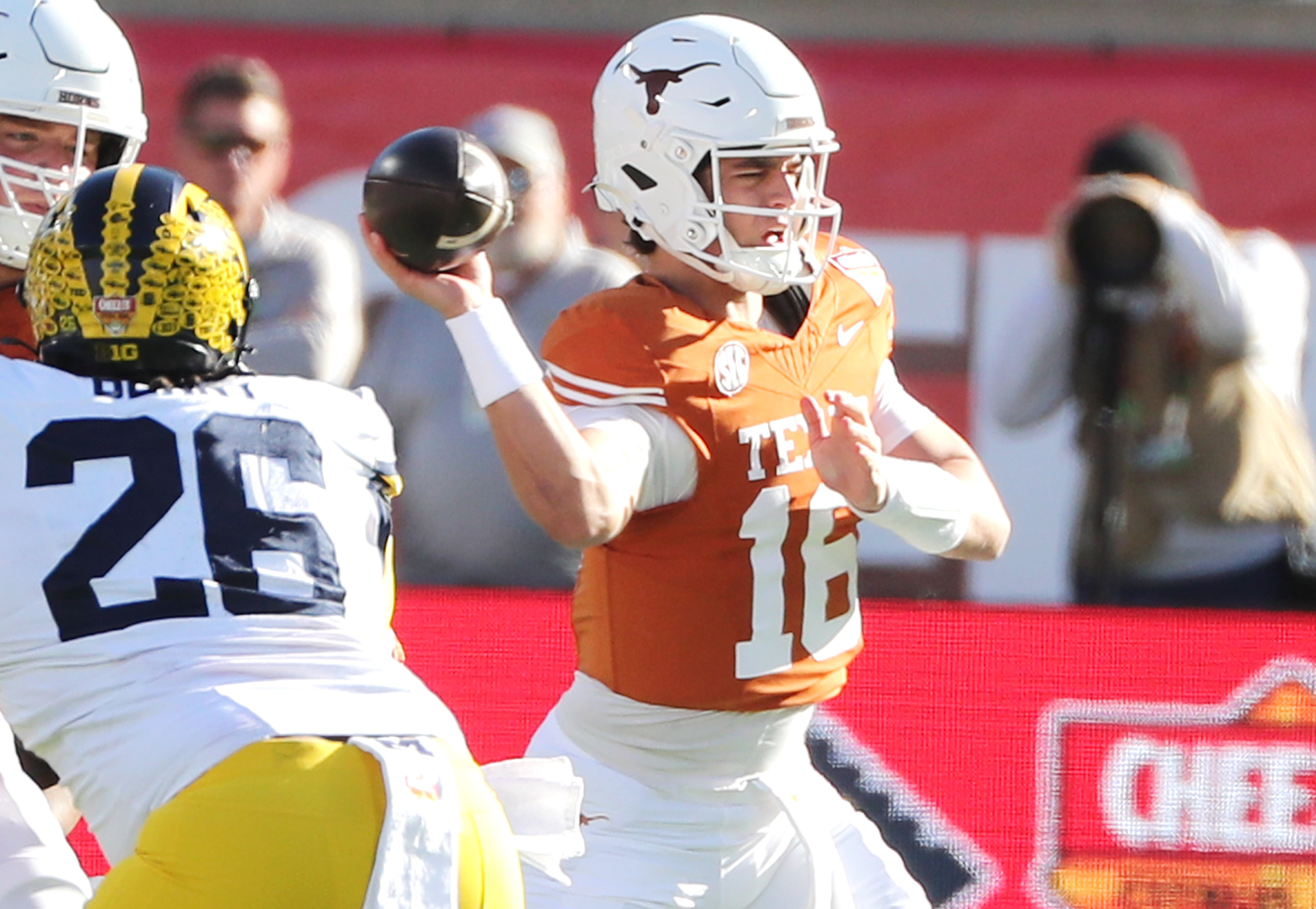Texas quarterback Arch Manning throws during the Cheez-It Citrus Bowl...
