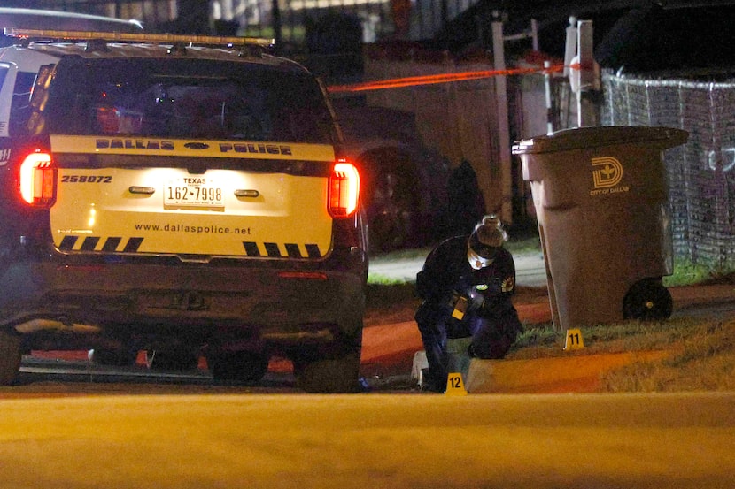Dallas police investigate a police shooting in the 1200 block of Presidio Avenue, Saturday,...
