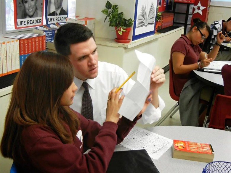 State Rep. and U.S. Senate candidate James Talarico works with a student at Jeremiah Rhodes Middle School in San Antonio, where he taught between 2011-13. 
