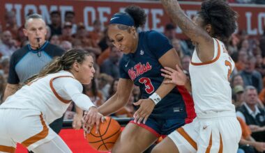 Mississippi guard Kaitlin Peterson (3) is squeezed between Texas guards Jordan Lee, left, and Rori Harmon, right, during the first half of an NCAA college basketball game in Austin, Texas, Sunday, Jan. 4, 2026. (AP Photo/Rodolfo Gonzalez)