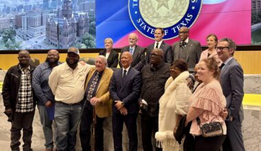 Family of Tommy Lee Walker with Dallas County officials.