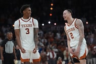 Texas guard Dailyn Swain (3) and guard Chendall Weaver (2) celebrate their win over...