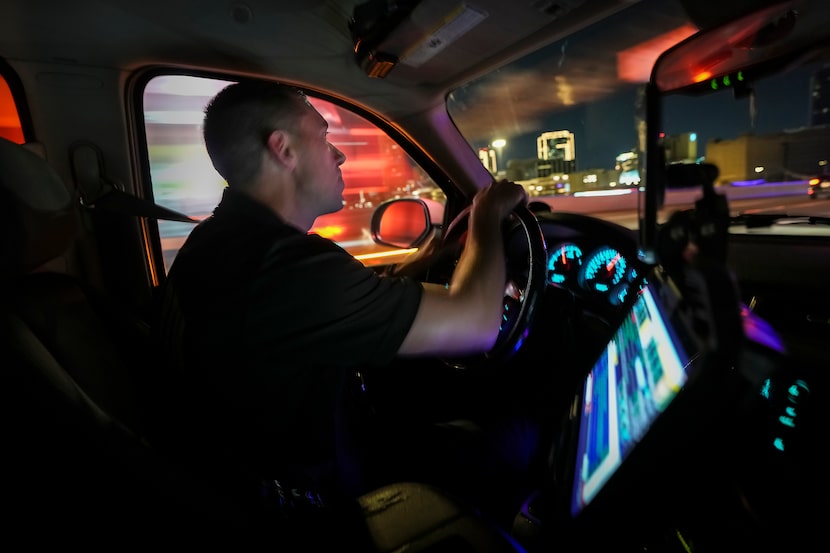 Fort Worth Fire Department Capt. Trent Robinson passes the downtown Fort Worth skyline as he...