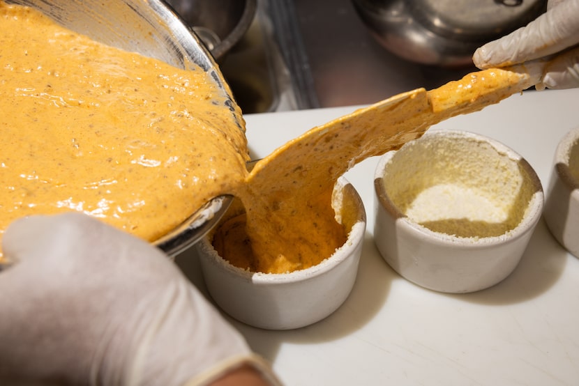 The base for the Frito Chili Soufflé is made with Mornay, cheddar cheese and beef chili. 