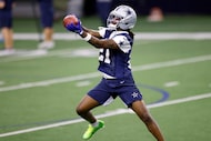 Dallas Cowboys cornerback Caelen Carson (21) catches a pass during the second day of...